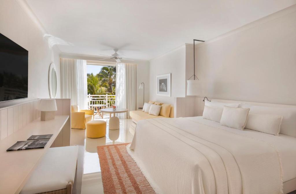 Кровать или кровати в номере LUX* Belle Mare Resort & Villas