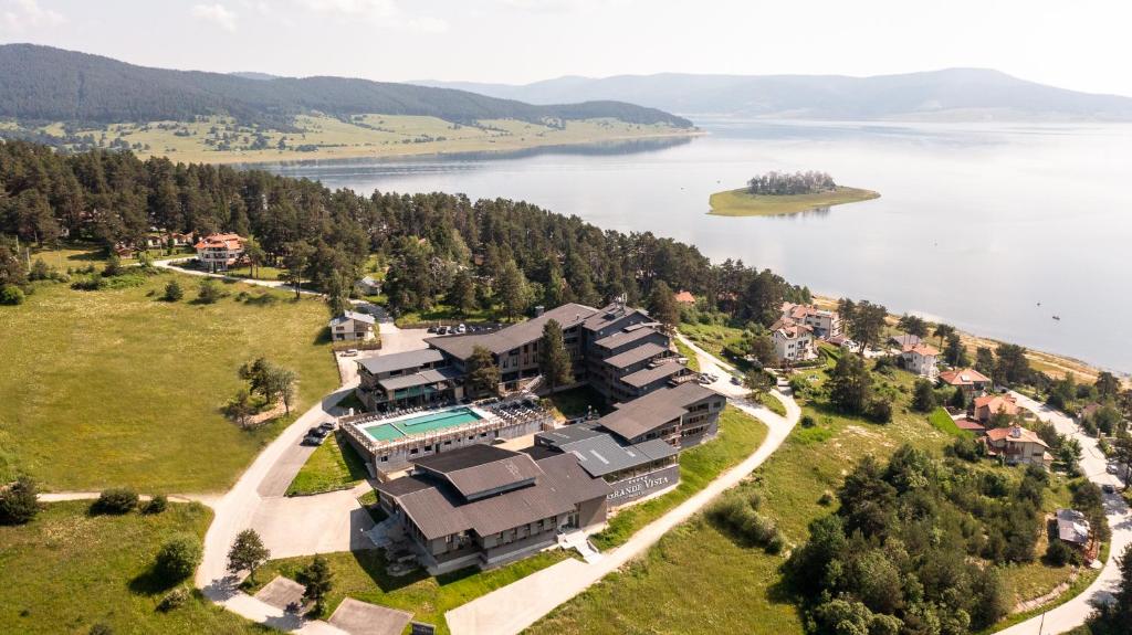 an aerial view of a house on the shore of a lake at Grande Vista Resort & Spa in Tsigov Chark