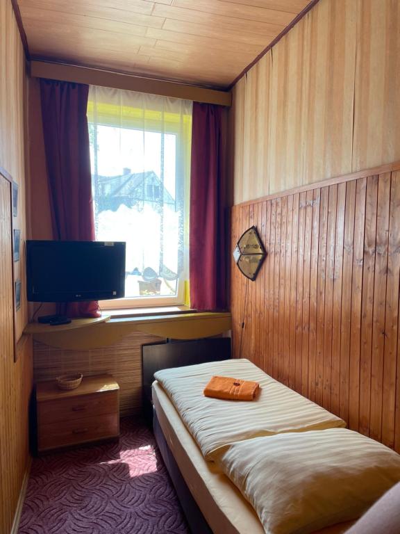 Postel nebo postele na pokoji v ubytování Hotel U Branky