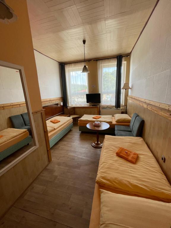 Postel nebo postele na pokoji v ubytování Hotel U Branky