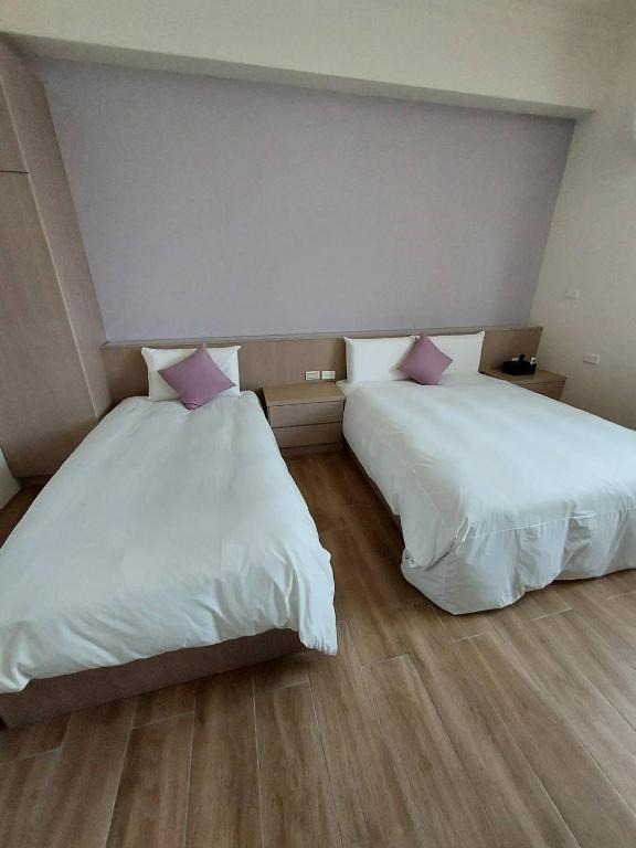 Postel nebo postele na pokoji v ubytování Miss Travel Homestay