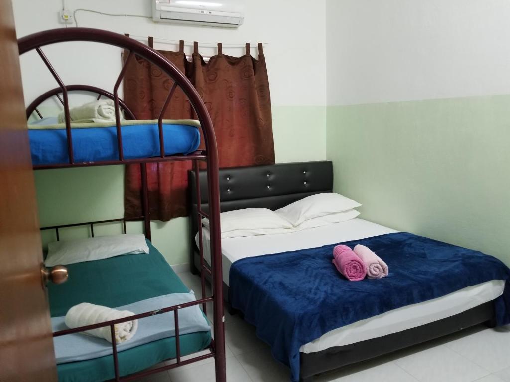 Postel nebo postele na pokoji v ubytování Sri impiana