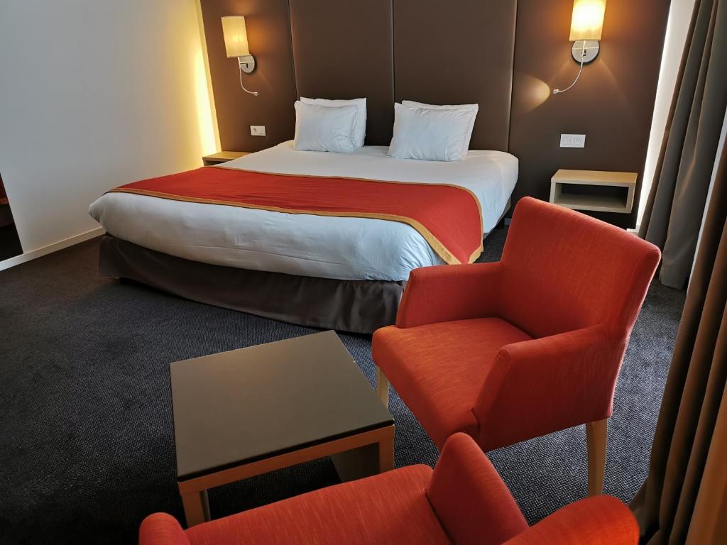 Postel nebo postele na pokoji v ubytování Hotel de la Source