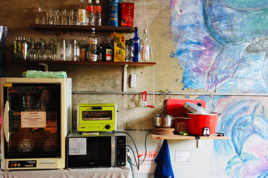 Kuchyň nebo kuchyňský kout v ubytování Fuqi Hostel - Heping