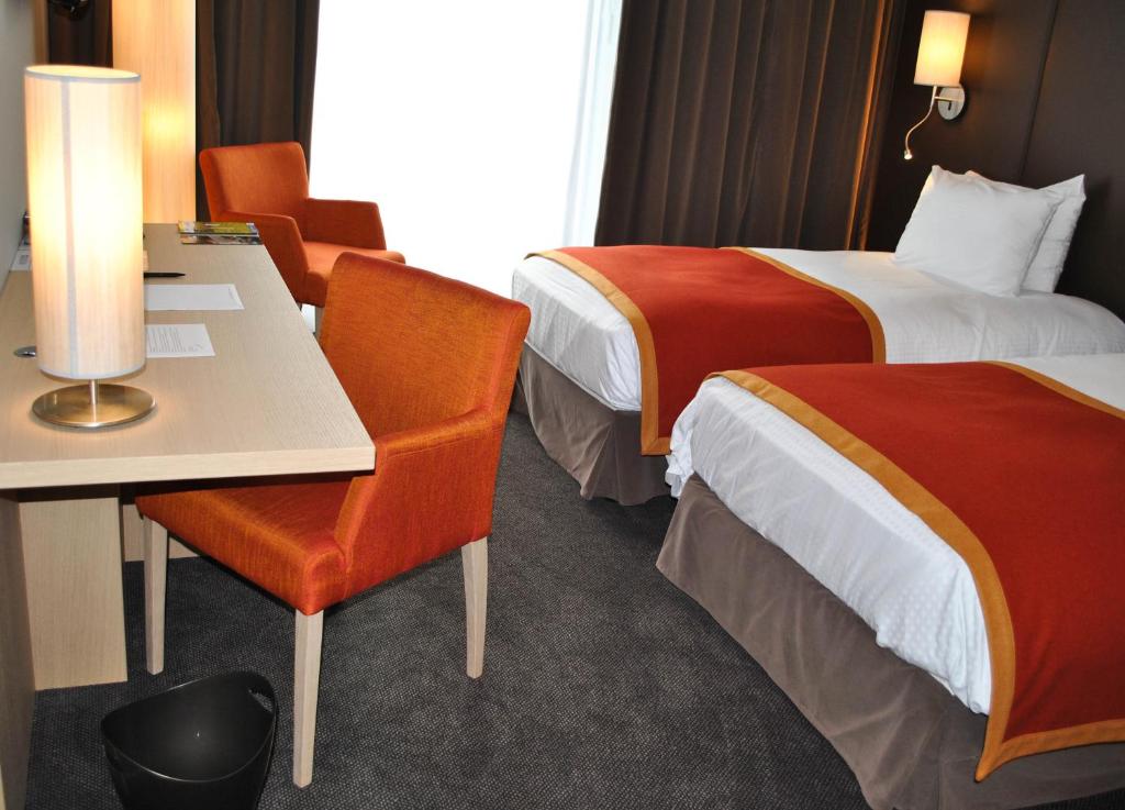 Postel nebo postele na pokoji v ubytování Hotel de la Source