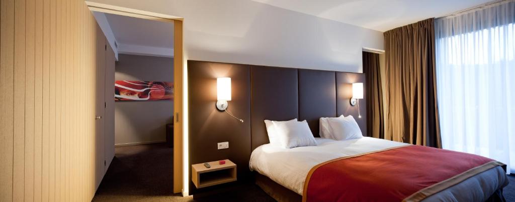Postel nebo postele na pokoji v ubytování Hotel de la Source