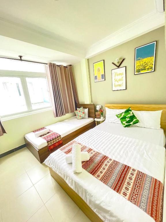 Posteľ alebo postele v izbe v ubytovaní Jasmine Hotel