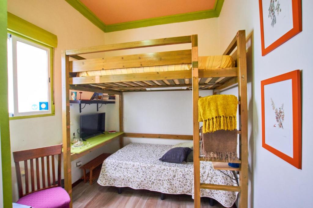 a bedroom with two bunk beds and a desk at Studio Plaza Farray in Las Palmas de Gran Canaria