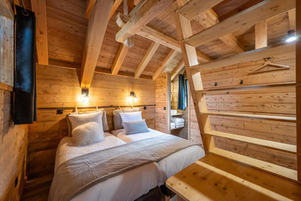 Postel nebo postele na pokoji v ubytování Les chalets d'Éléna