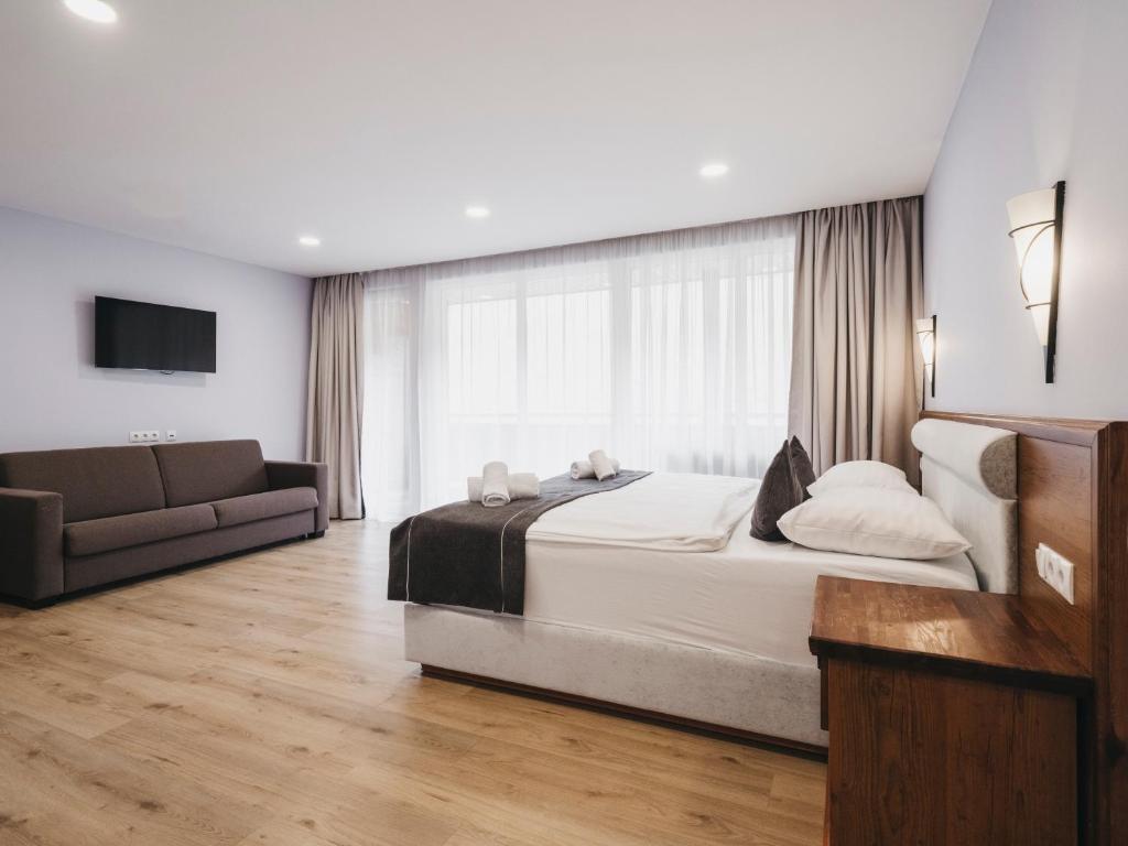 Postel nebo postele na pokoji v ubytování Hotel Victoria by VAYA