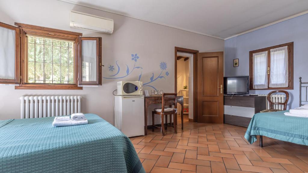 Postel nebo postele na pokoji v ubytování 3T - Affitti Brevi Italia