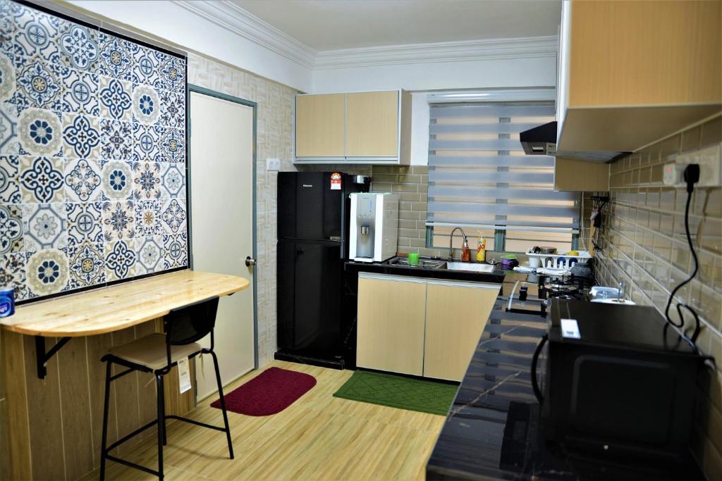 Kuchyň nebo kuchyňský kout v ubytování Awedee Homestay Putrajaya