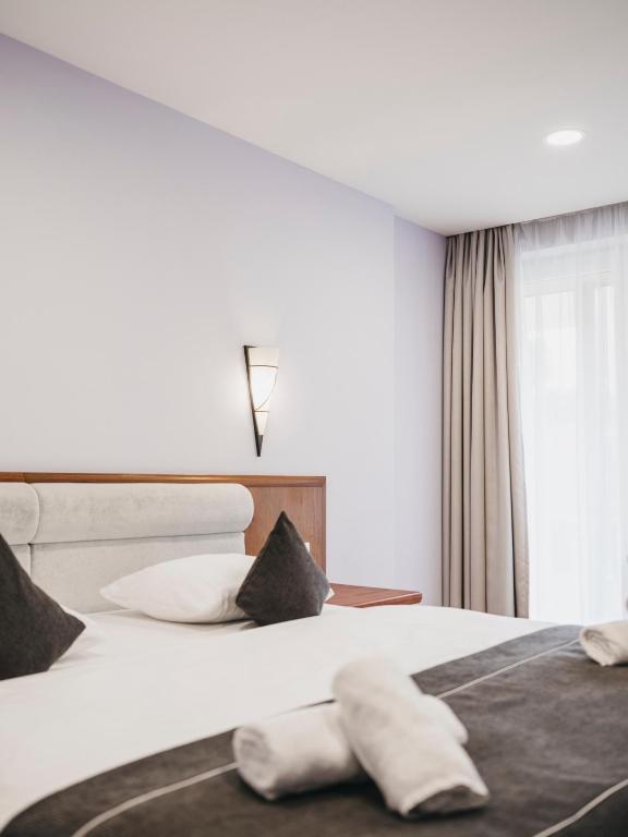 Postel nebo postele na pokoji v ubytování Hotel Victoria by VAYA