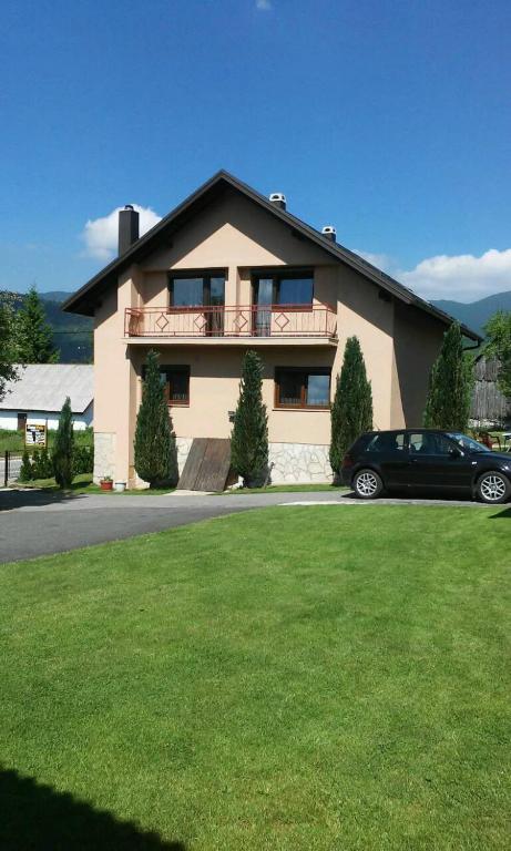 a house with a car parked in front of it at House Pribić in Vrelo Koreničko