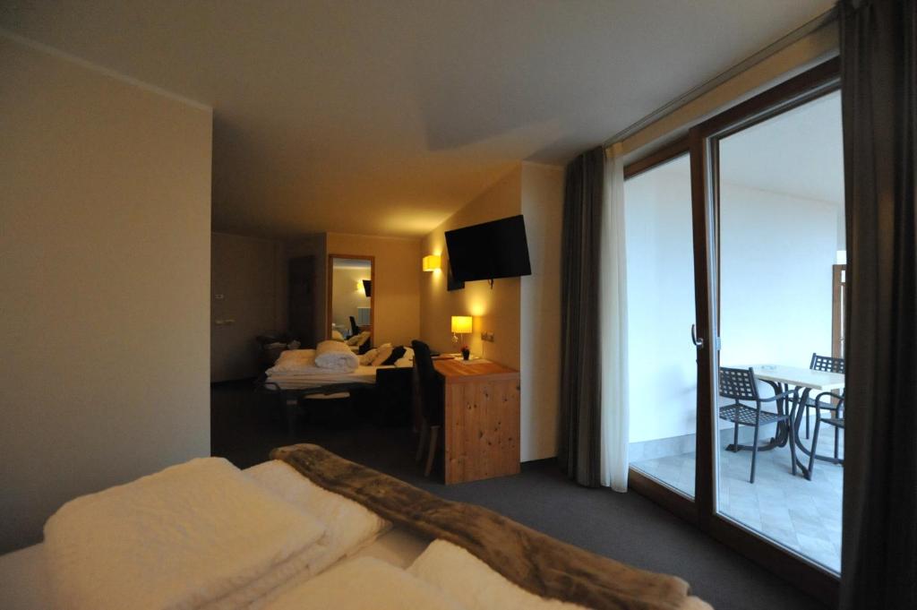 Postel nebo postele na pokoji v ubytování Bio Hotel Brusago Vital & Wellness