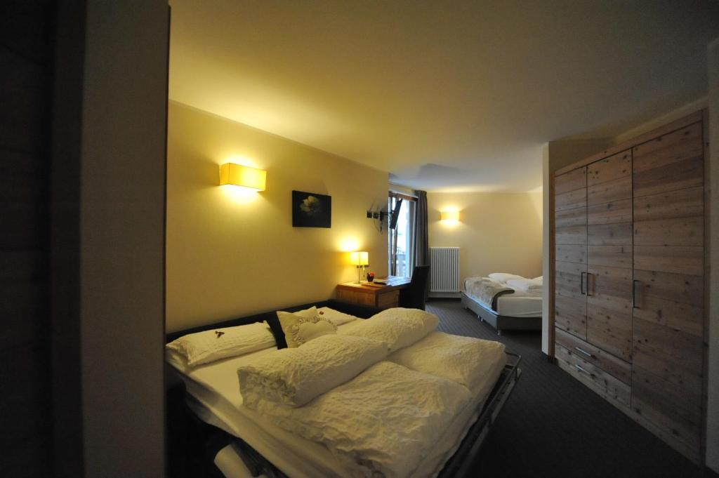 Postel nebo postele na pokoji v ubytování Bio Hotel Brusago Vital & Wellness
