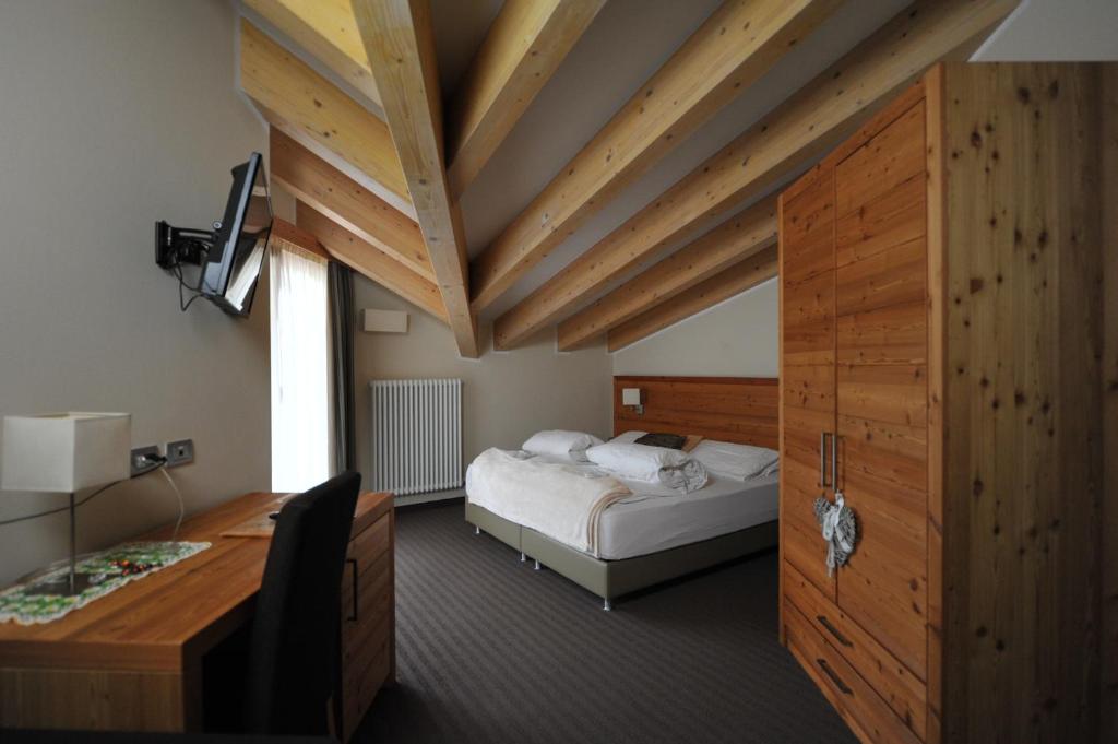 Postel nebo postele na pokoji v ubytování Bio Hotel Brusago Vital & Wellness