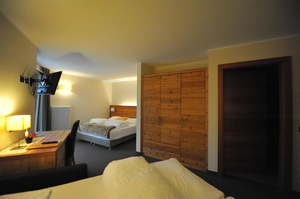 Postel nebo postele na pokoji v ubytování Bio Hotel Brusago Vital & Wellness