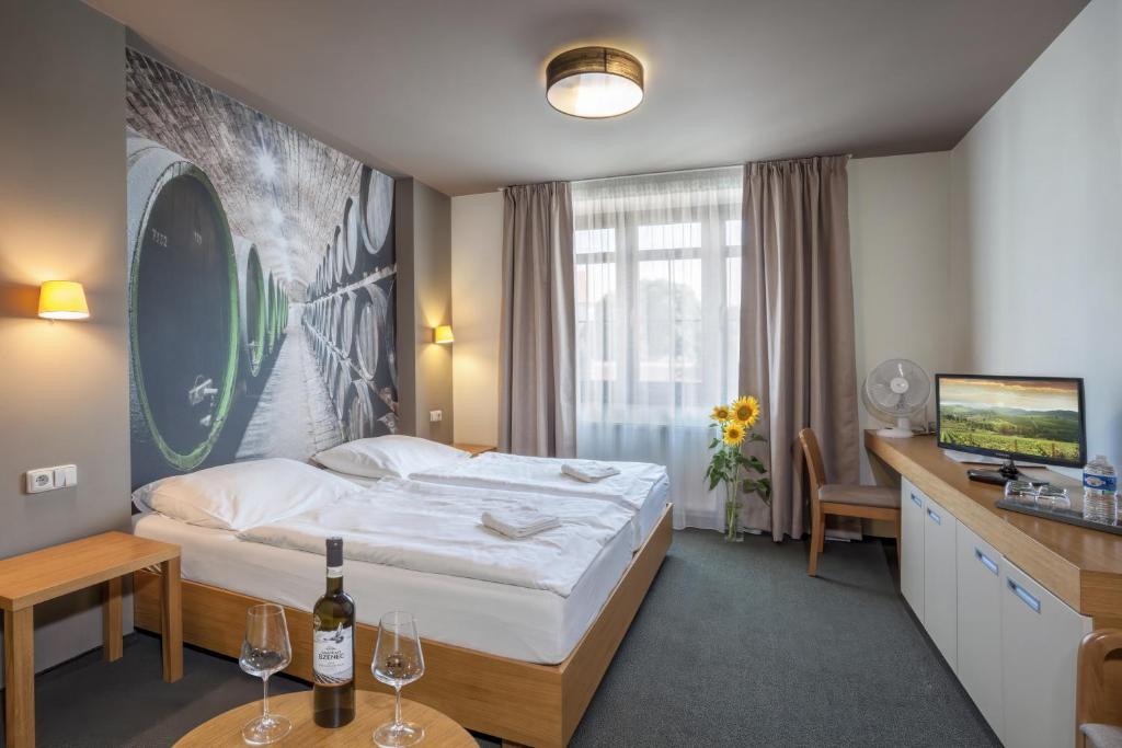 Postel nebo postele na pokoji v ubytování Hotel Lidový dům