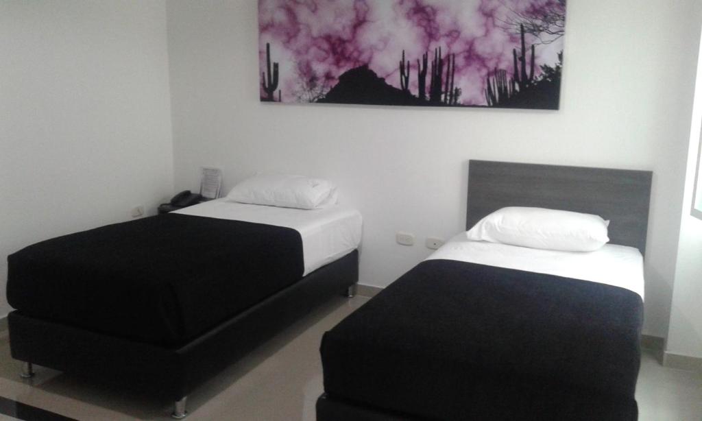 Postel nebo postele na pokoji v ubytování Hotel Onix T