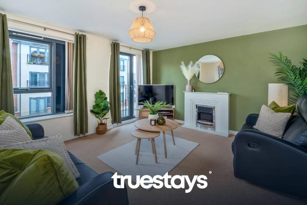 a living room with a couch and a table at NEW Greydawn House - Stunning 4 Bedroom House in Stoke-on-Trent in Stoke on Trent