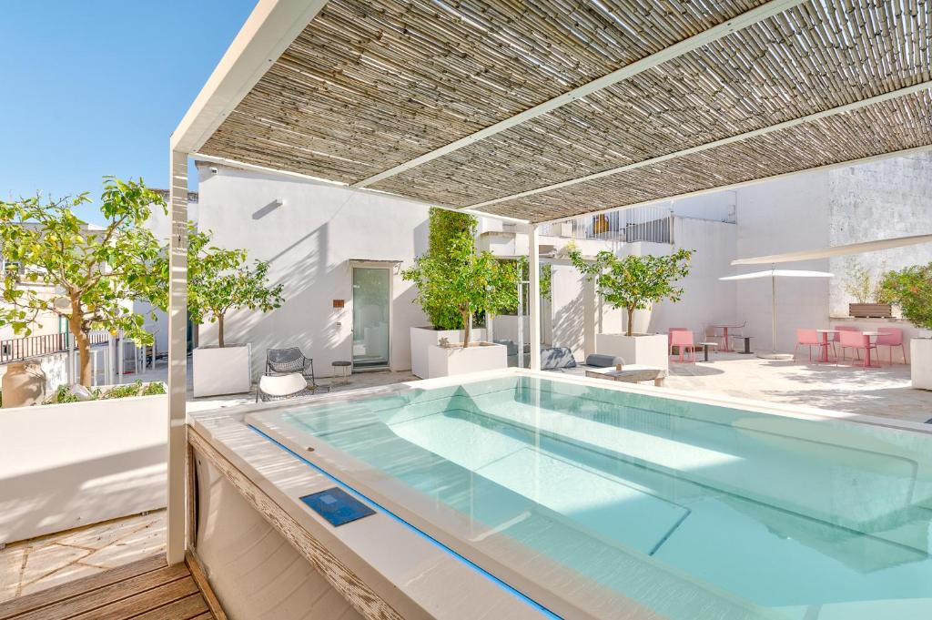 an indoor swimming pool in a house at Arya Nobile Dimora in Carovigno