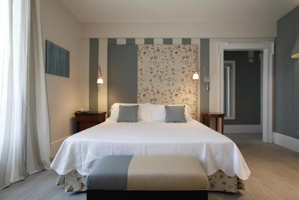 Postel nebo postele na pokoji v ubytování Hotel Arancioamaro