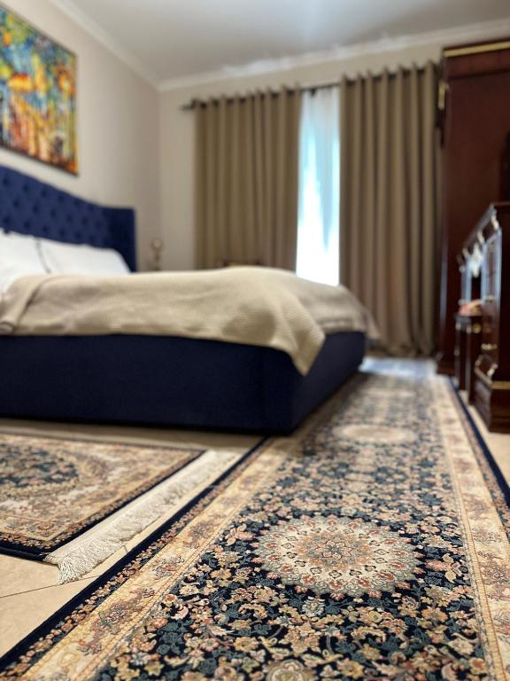 Postel nebo postele na pokoji v ubytování Dinasty Hotel
