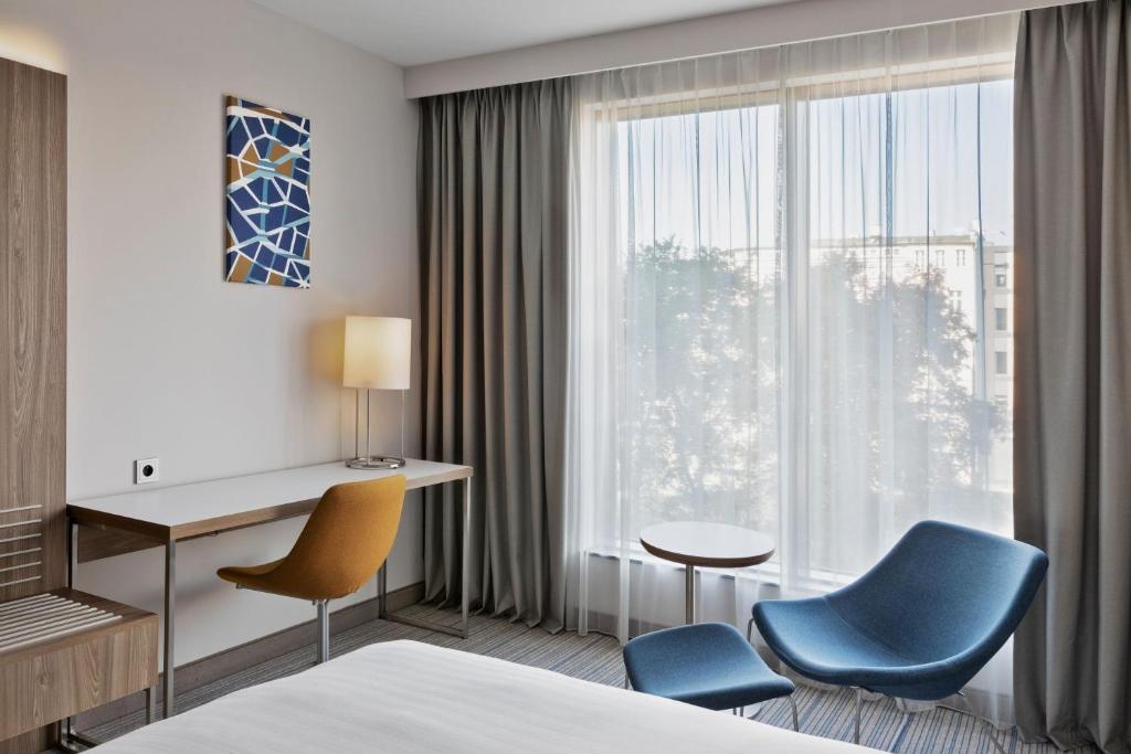 Postel nebo postele na pokoji v ubytování Courtyard by Marriott Szczecin City