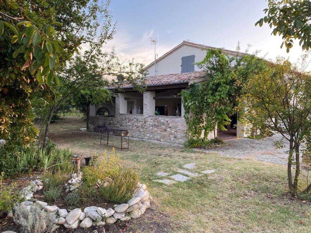 a house with a garden in front of it at Ca Baruffa B&B in Corpolò