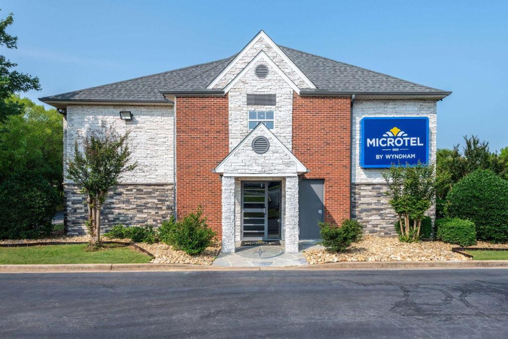 a building with a sign in front of it at Microtel Inn by Wyndham Spartanburg Duncan in Duncan