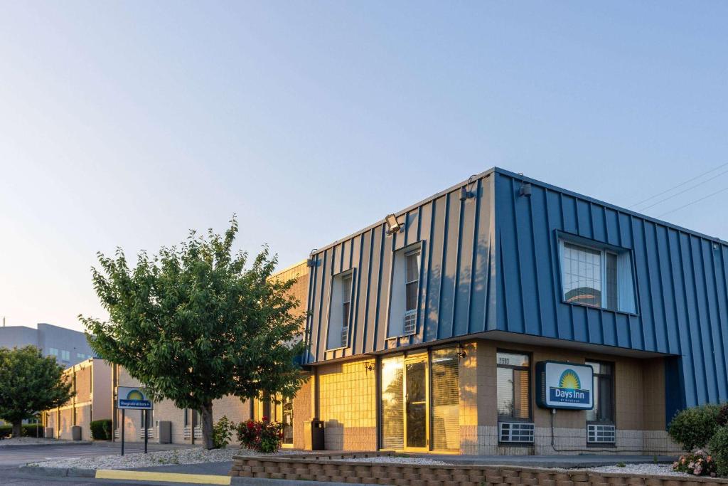 a blue building on the side of a street at Days Inn by Wyndham Winchester in Winchester