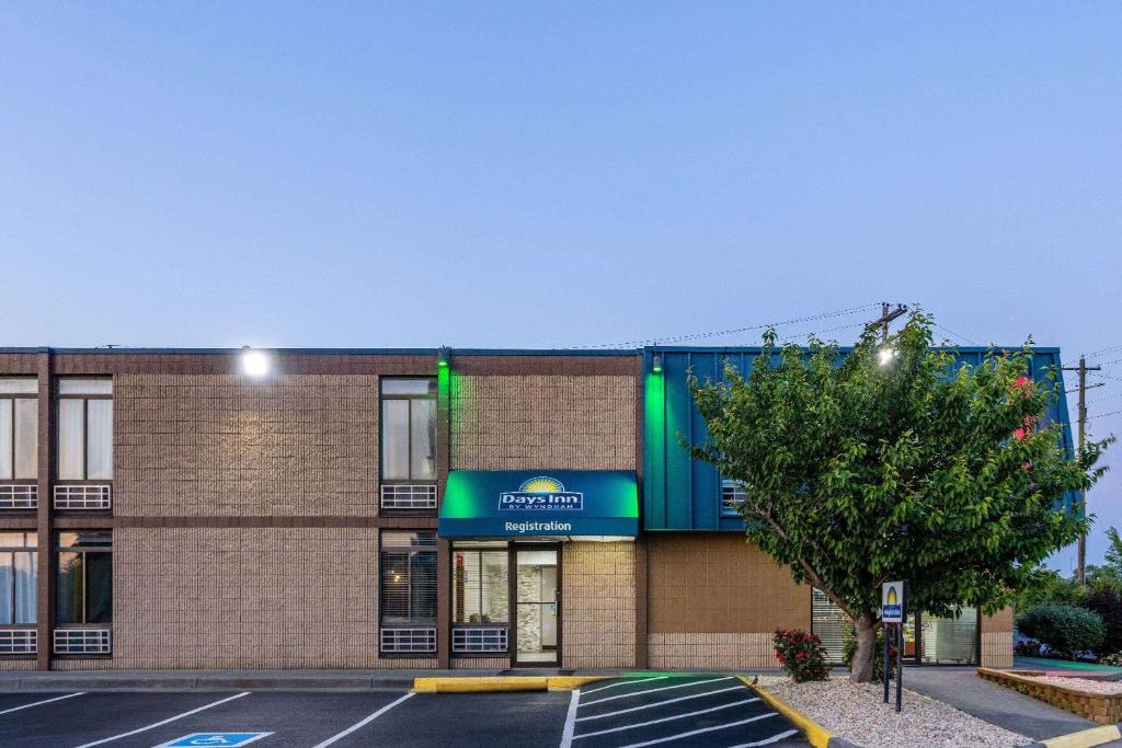 an empty parking lot in front of a building at Days Inn by Wyndham Winchester in Winchester