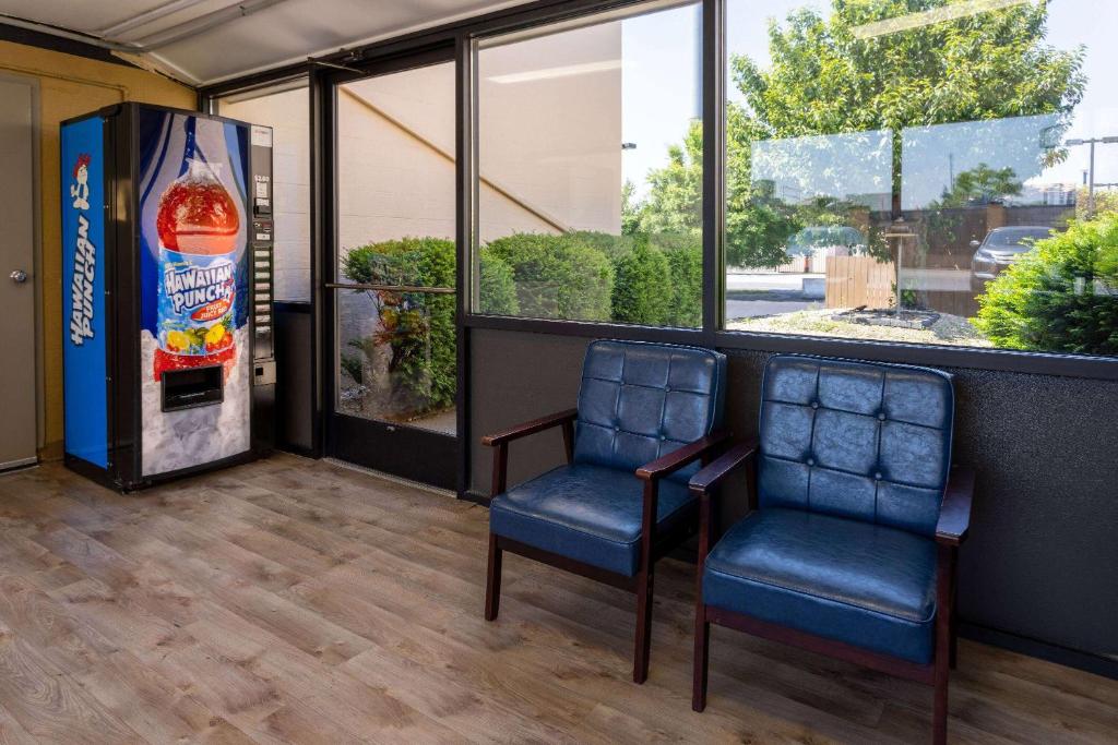 two chairs and a drink machine in a store at Days Inn by Wyndham Winchester in Winchester