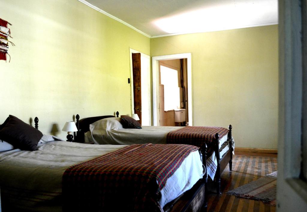 Postel nebo postele na pokoji v ubytování Casona Re-encuentro
