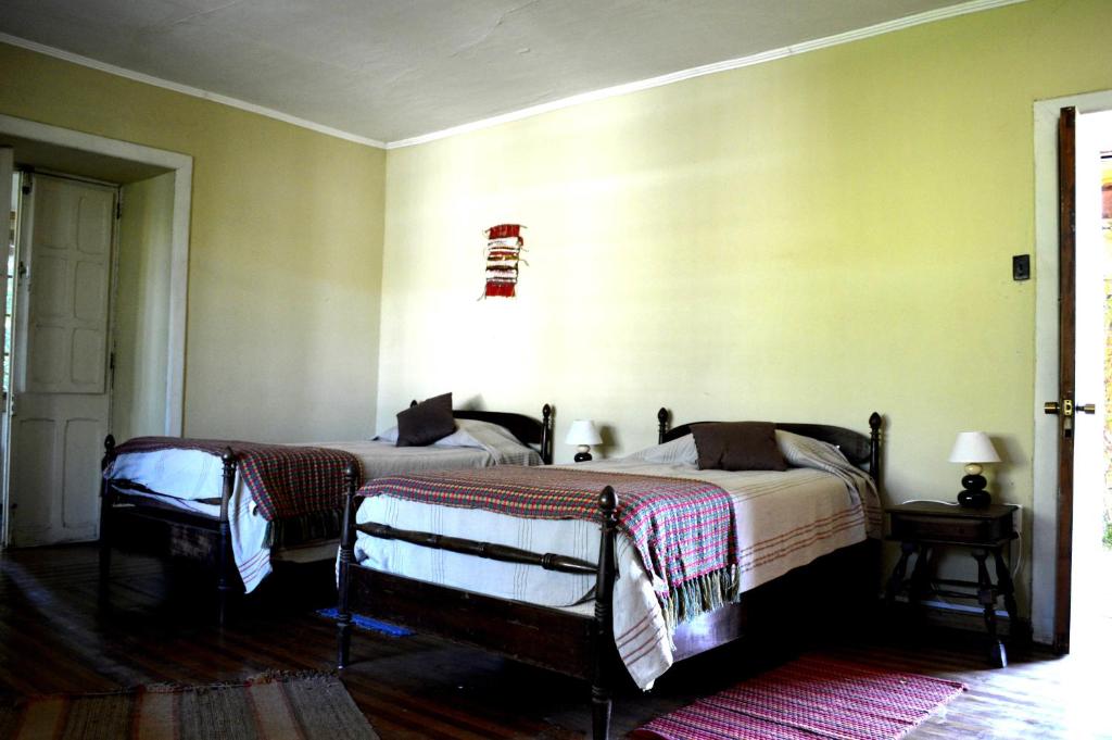 Postel nebo postele na pokoji v ubytování Casona Re-encuentro