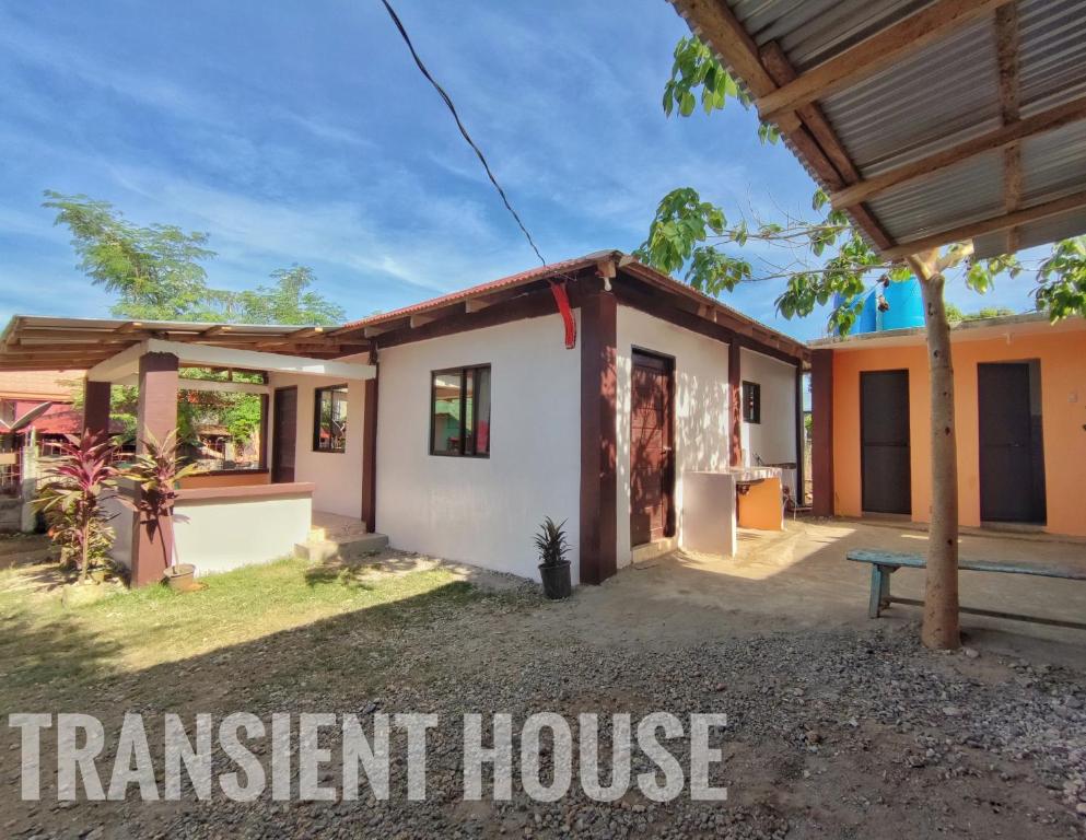 a home with a transient house with the words transient house at Patar White Beach Bolinao- Lilybeth's Transient House in Bolinao