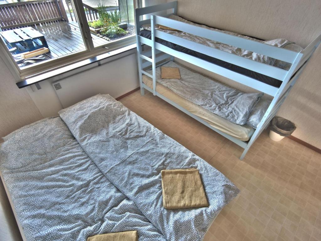 a bedroom with a bunk bed next to a ladder at The Private Quarters in Vårsta