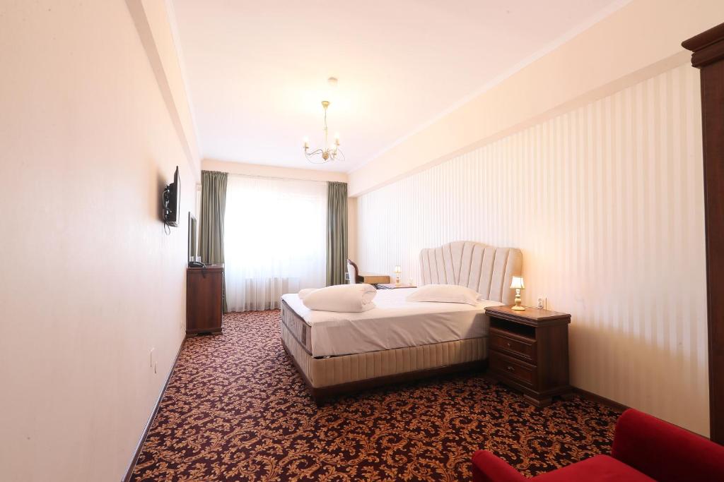 Postel nebo postele na pokoji v ubytování Hotel Impero