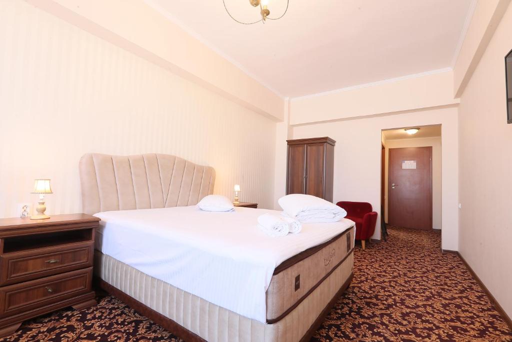 Postel nebo postele na pokoji v ubytování Hotel Impero