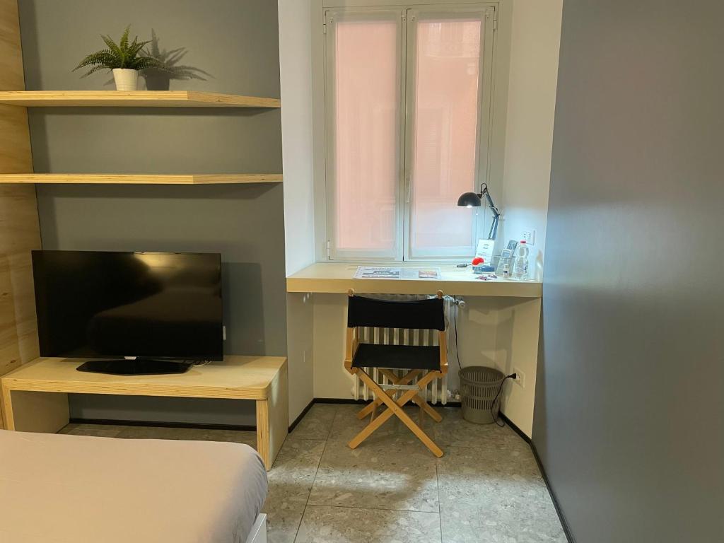 TV a/nebo společenská místnost v ubytování Torino48 Guesthouse