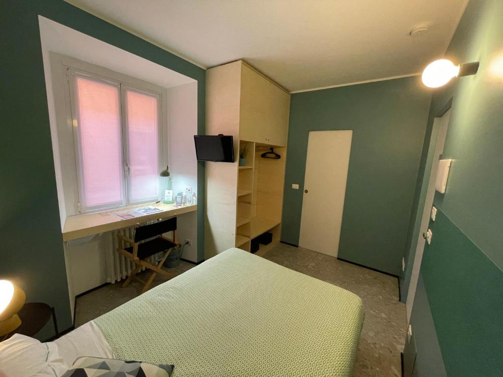 Postel nebo postele na pokoji v ubytování Torino48 Guesthouse
