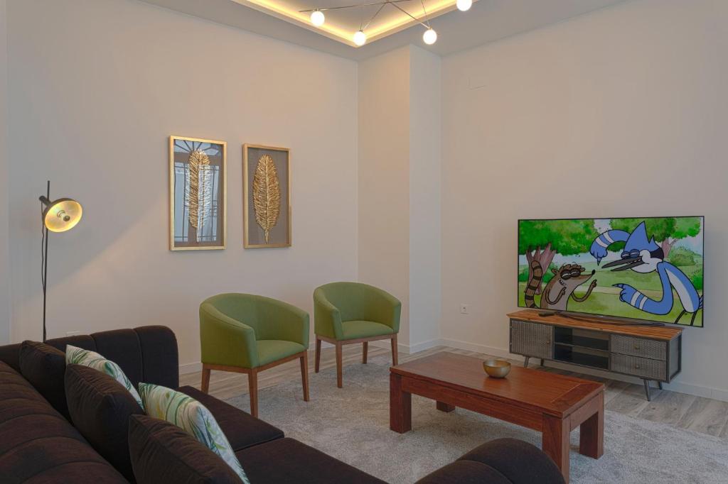 Televízia a/alebo spoločenská miestnosť v ubytovaní Fresh Velazquez Apartments