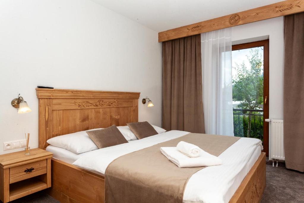 Postel nebo postele na pokoji v ubytování Drevenica u Pavla