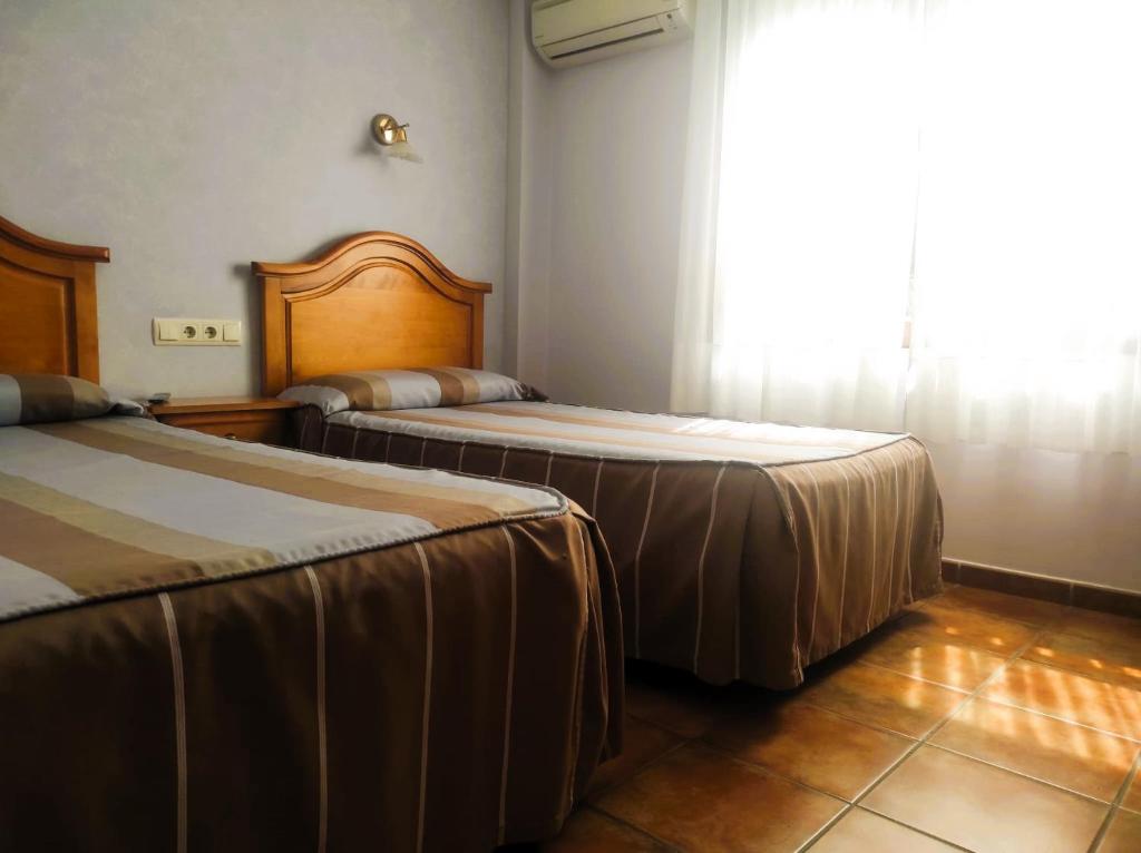 Postel nebo postele na pokoji v ubytování Hostal la Cepa