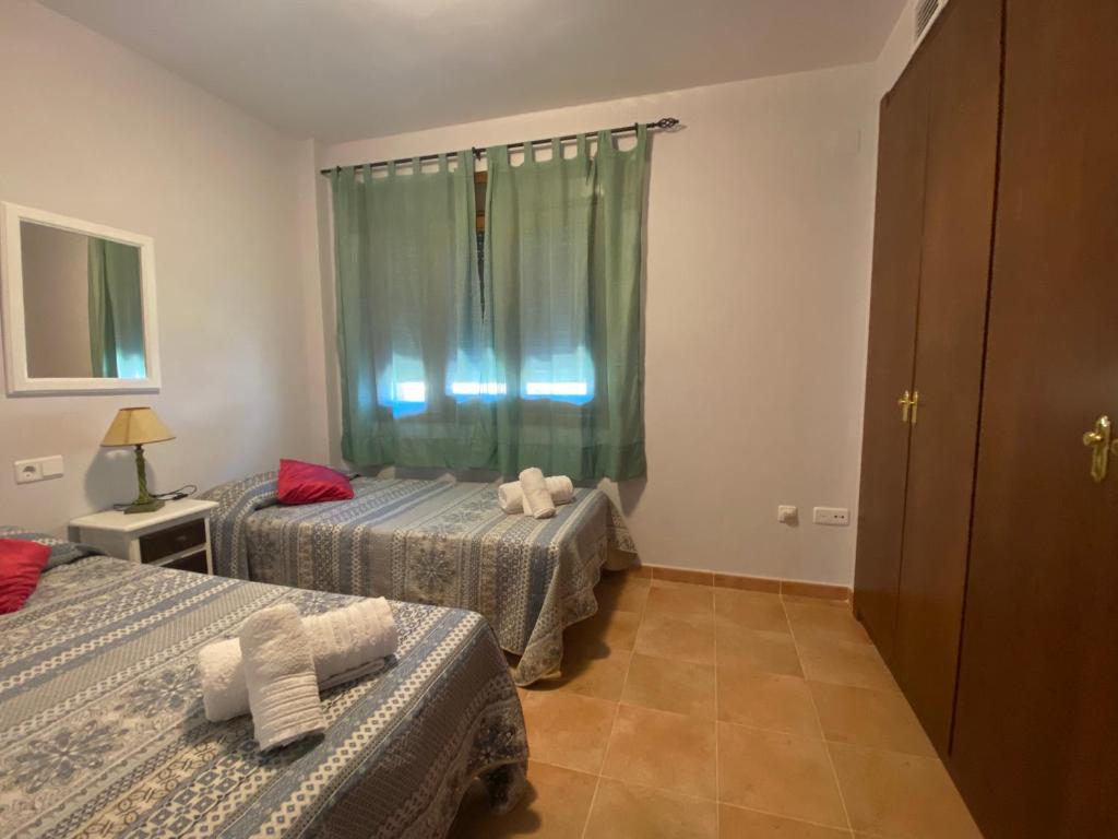 Posteľ alebo postele v izbe v ubytovaní CostaEsuri Vacaciones (Casa Marina)