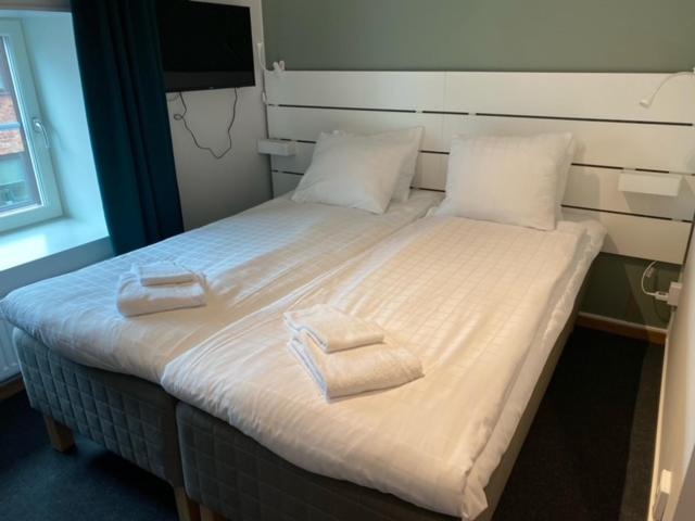 Postel nebo postele na pokoji v ubytování Ahlgrens Hotell Bed & Breakfast
