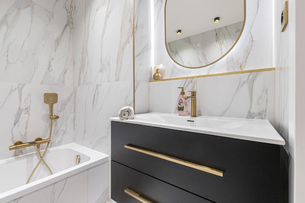 a bathroom with a sink and a mirror at St George in Antibes