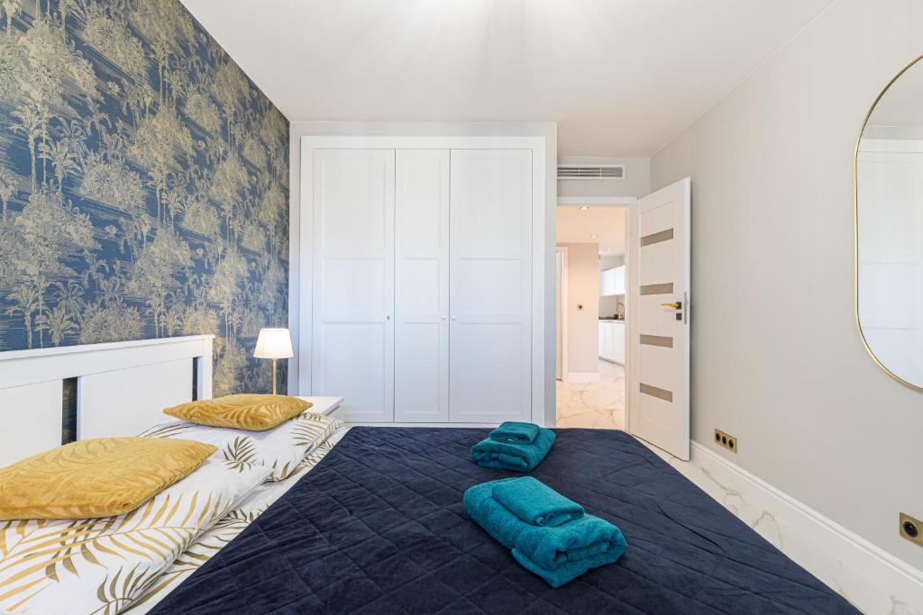 a bedroom with two beds and a mirror at St George in Antibes