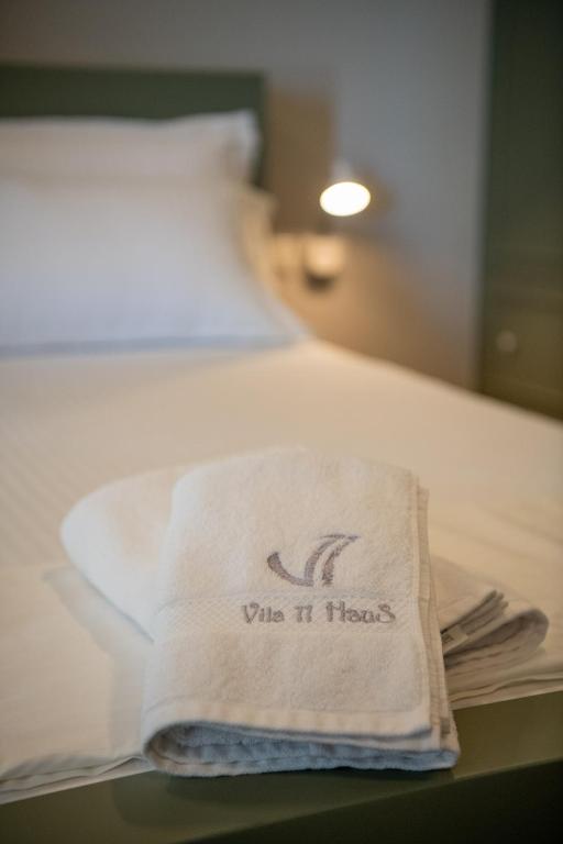 Postel nebo postele na pokoji v ubytování Hotel Vila 11